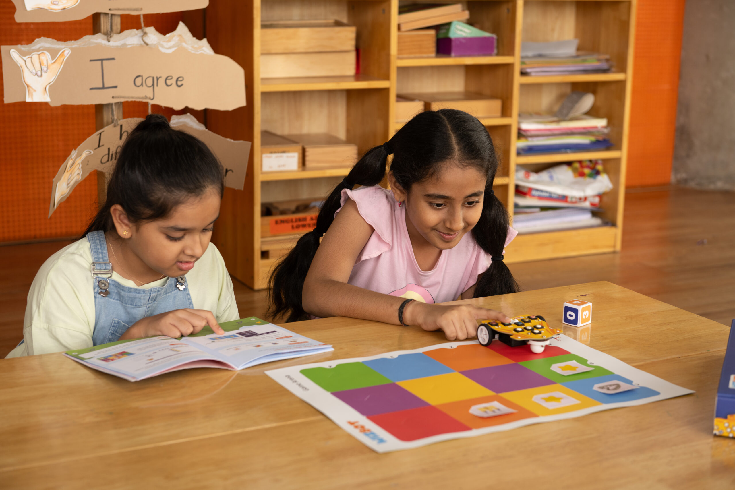 Kids doing activity from activity book.jpg